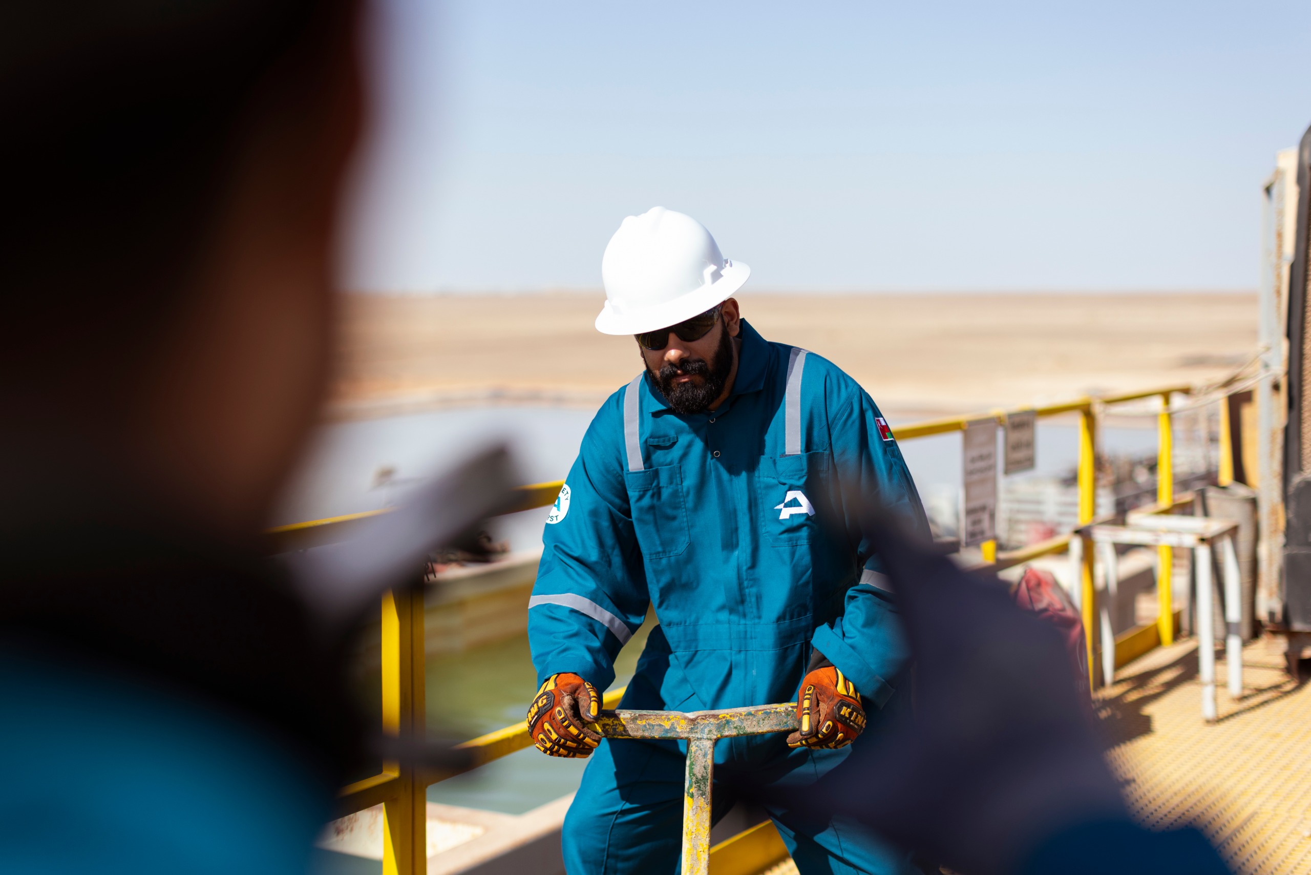 ABRAJ technician working safely on the rig
