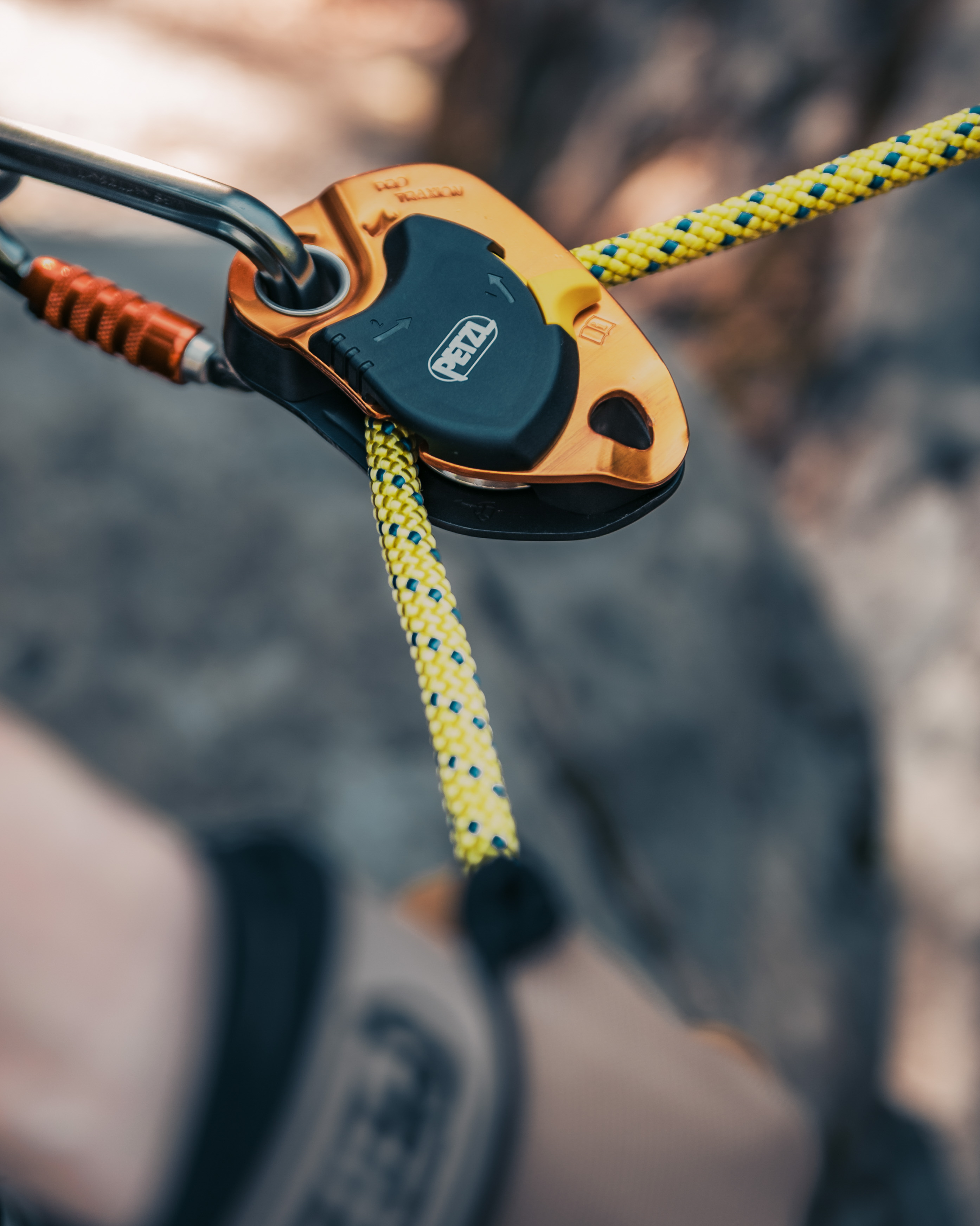 Smiling course participant wearing a helmet with a camera during outdoor rescue training