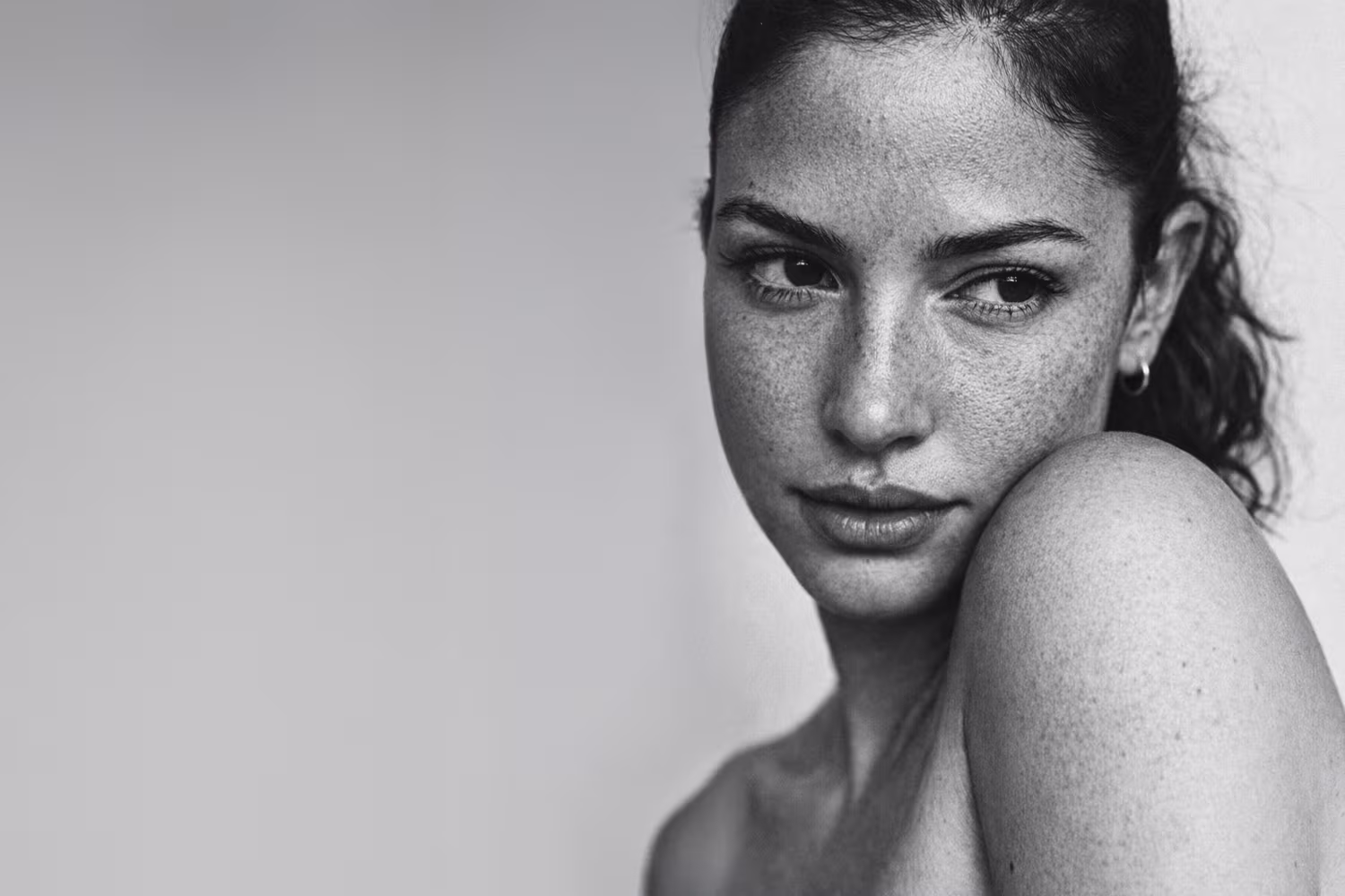 Black and white close-up portrait representing rough skin texture concern at CAMI