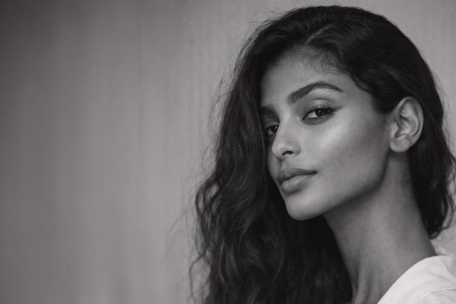 Black and white portrait representing jawline definition and lower face structure concern at CAMI