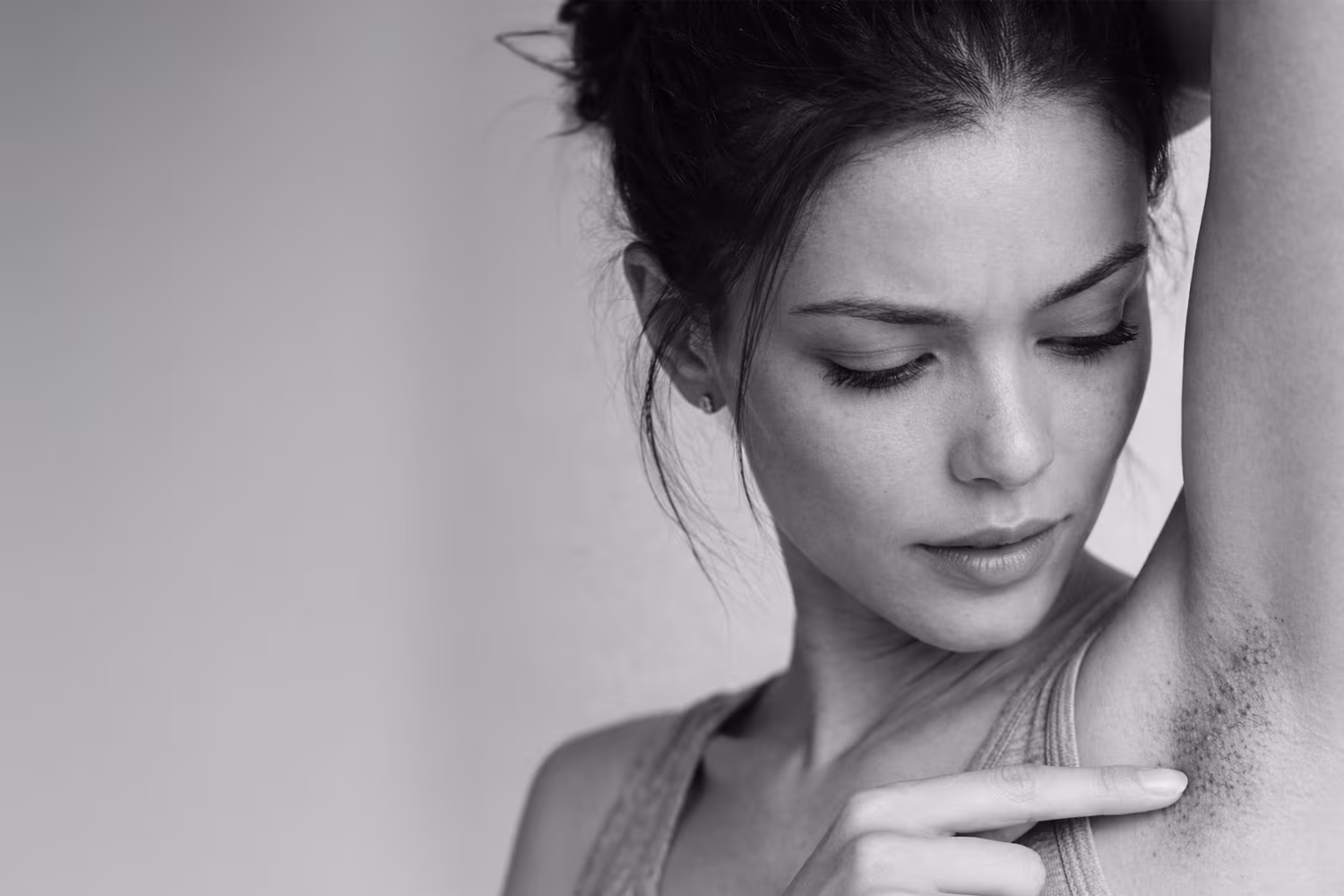 Black and white close-up representing ingrown hair concern from shaving and waxing at CAMI