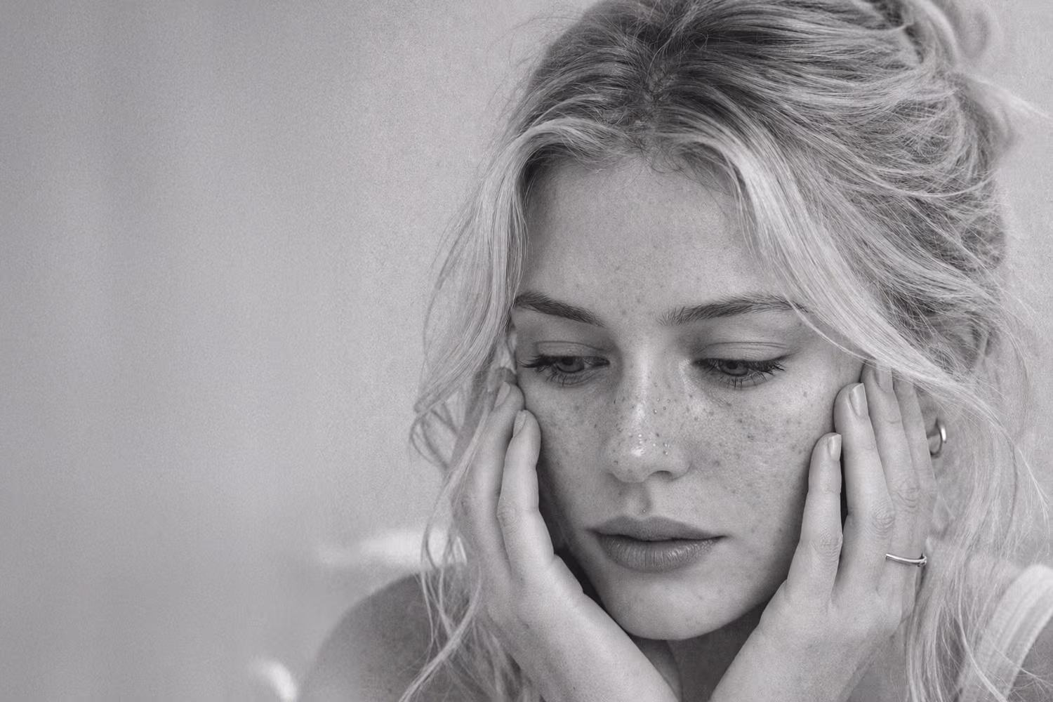 Black and white close-up representing blackheads and whiteheads clogged pore concern at CAMI