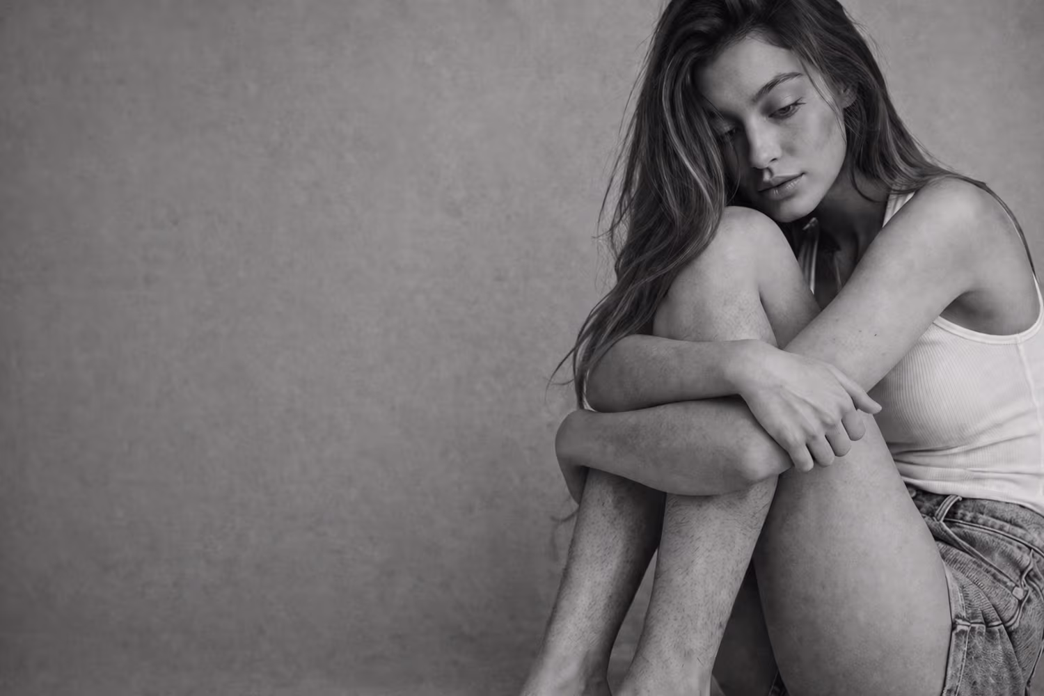Black and white portrait representing unwanted hair and hair removal concern at CAMI
