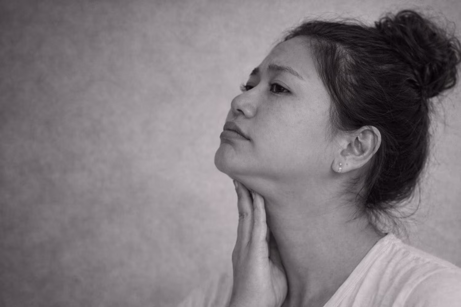 Black and white portrait representing double chin and submental fullness concern at CAMI