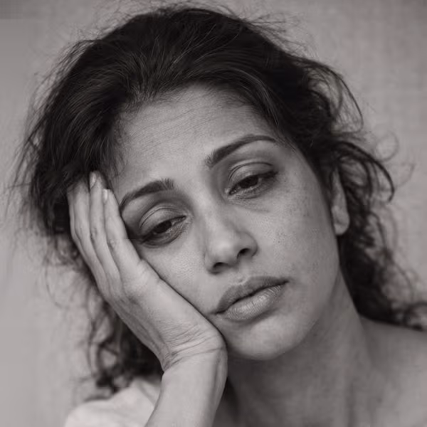 Black and white portrait representing fatigue and low energy as a hormonal wellness concern at CAMI
