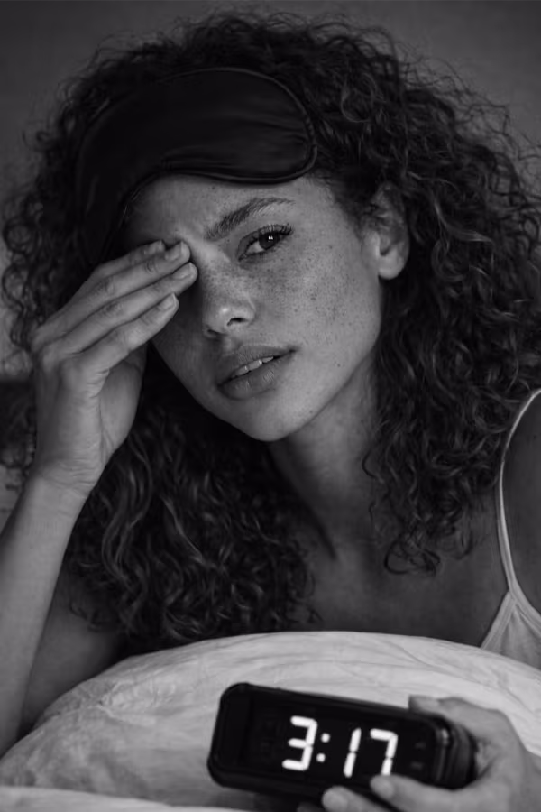Black and white portrait representing sleep disturbances and hormonal insomnia concern at CAMI