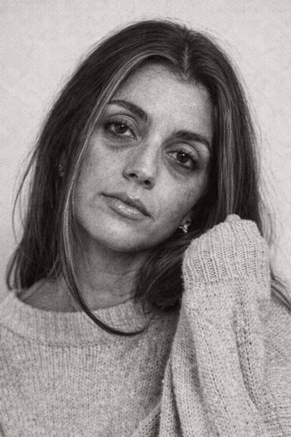 Black and white portrait representing under-eye hollows and tear trough shadowing concern at CAMI