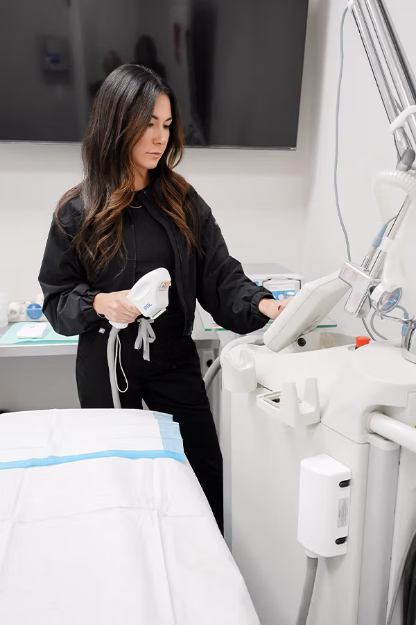 CAMI provider performing skin tightening treatment on patient