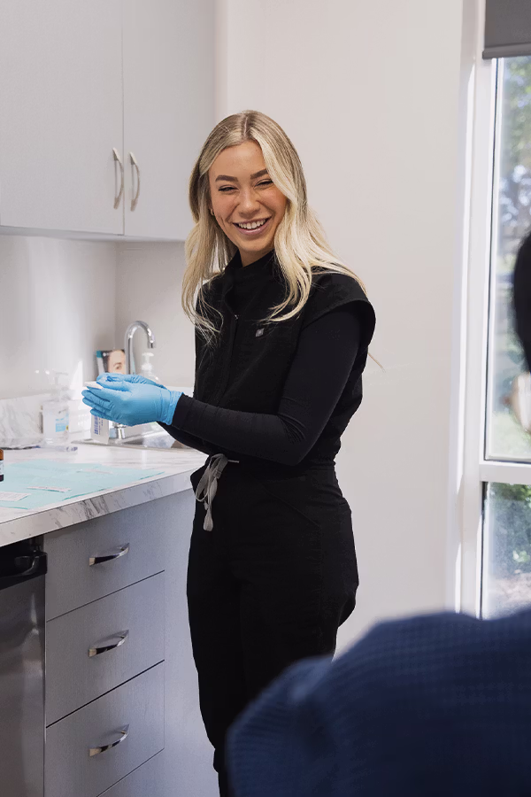 CAMI provider administering male hair loss treatment at clinic