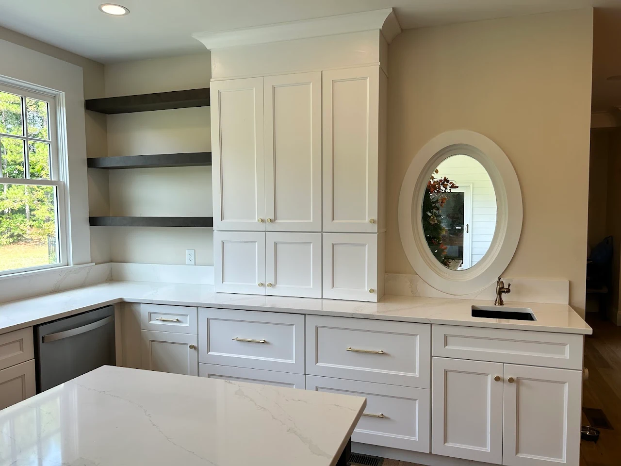 Lost Valley custom cabinet wall with round window