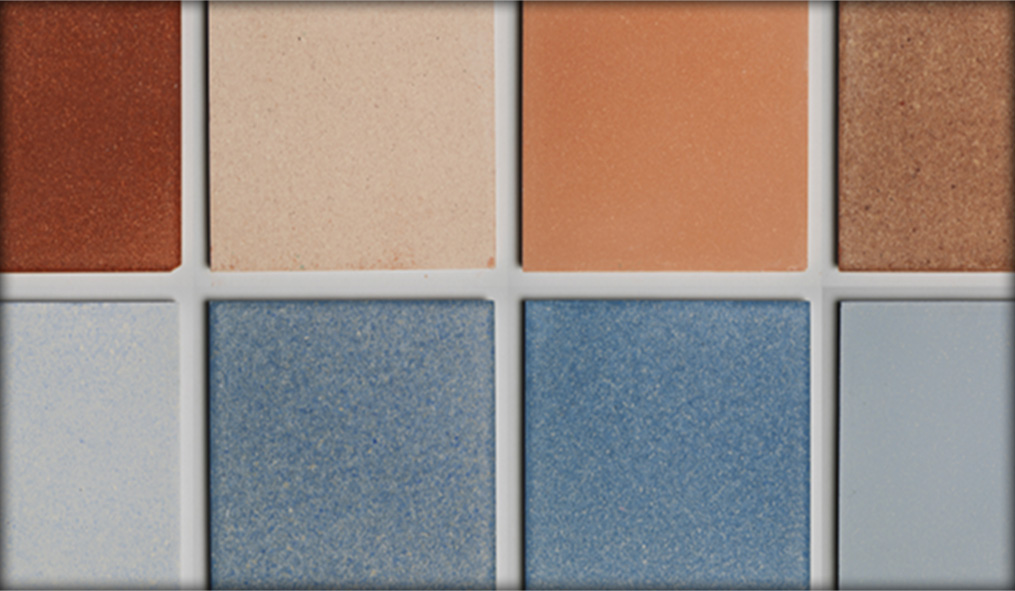 A close up of orange and blue sustainable Eralith tiles, showing the beautiful spectrum of colours possible using Dekiln's BioSintering technology. 