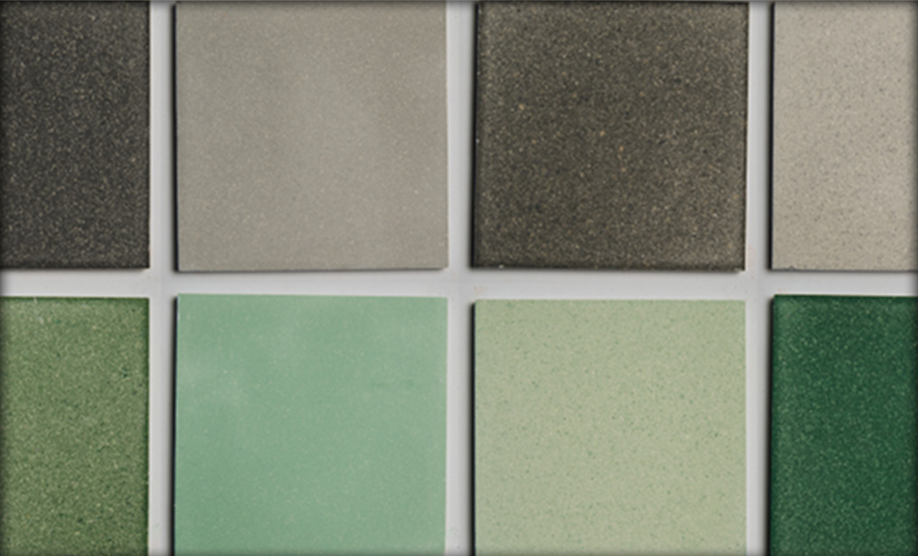 A close-up of green and grey sustainable Eralith tiles. 