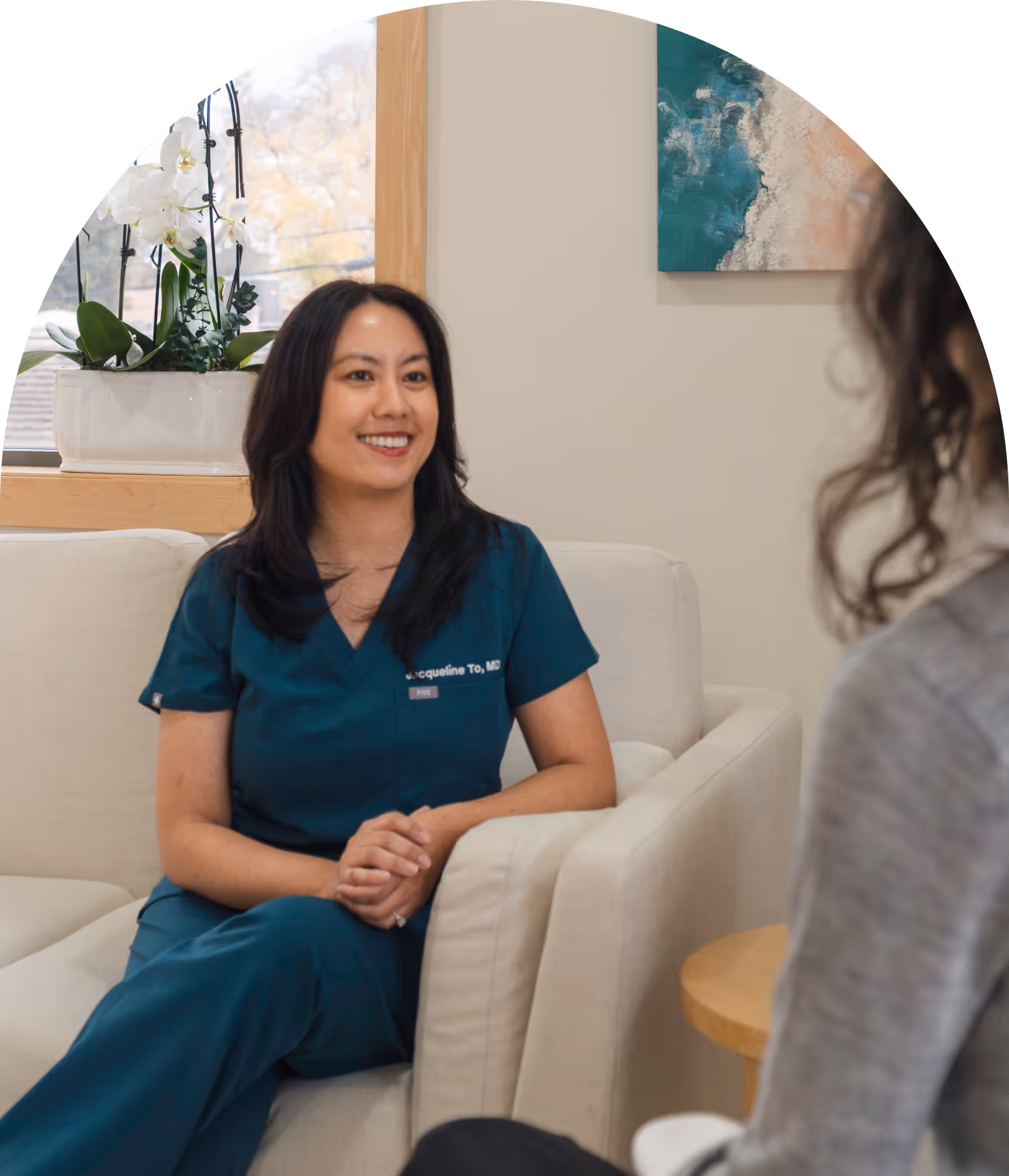 Dr. Jacqueline To meeting with a patient at Radiant Women's Health