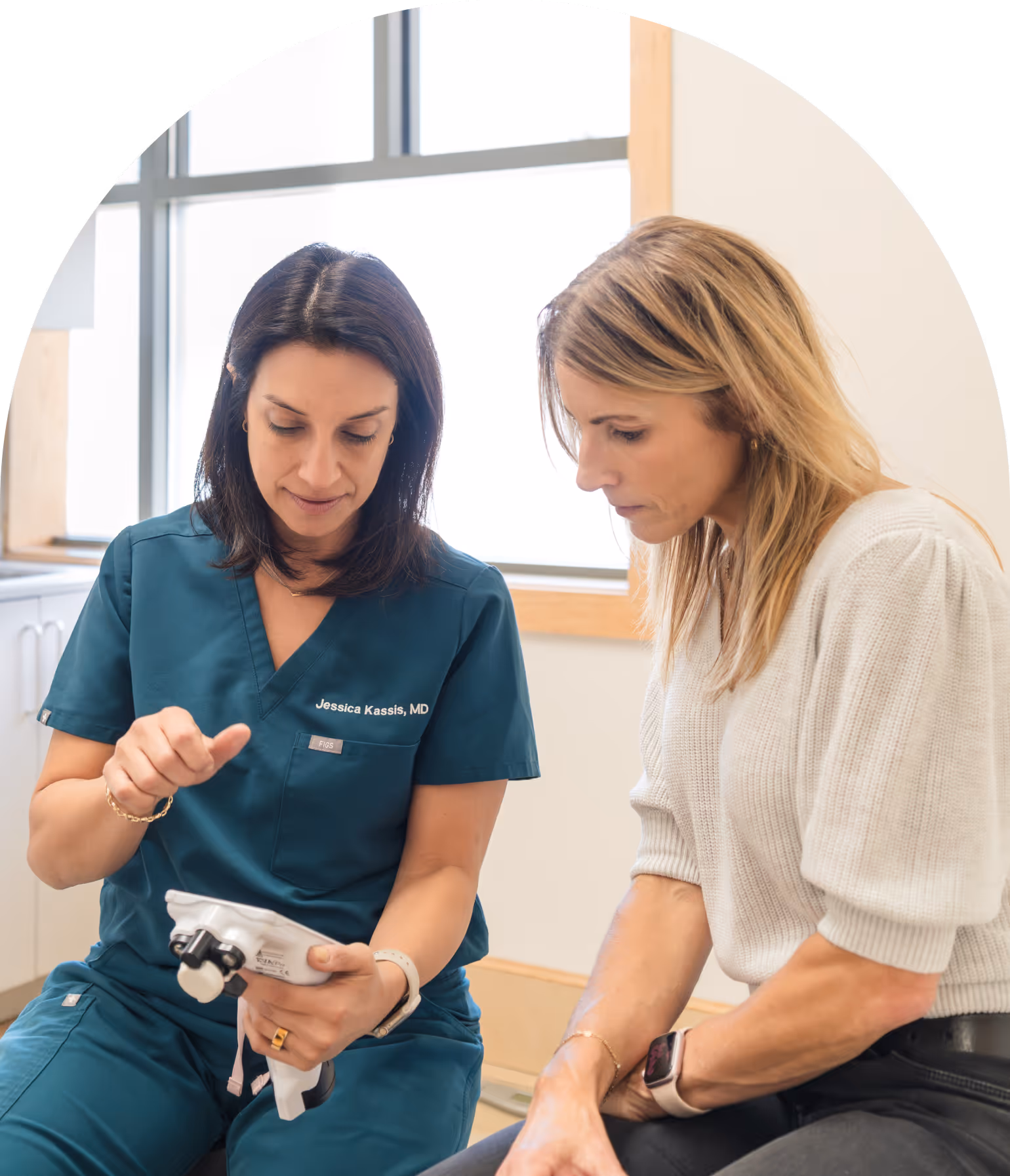 Dr. Kassis meeting with a patient at Radiant Women's Health