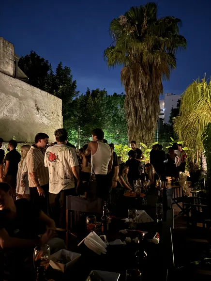A team gathering in a garden at night
