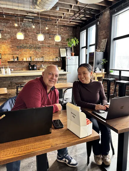 Two teammates working at the studio