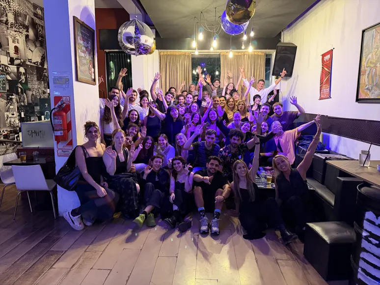 The team cheering at a company party