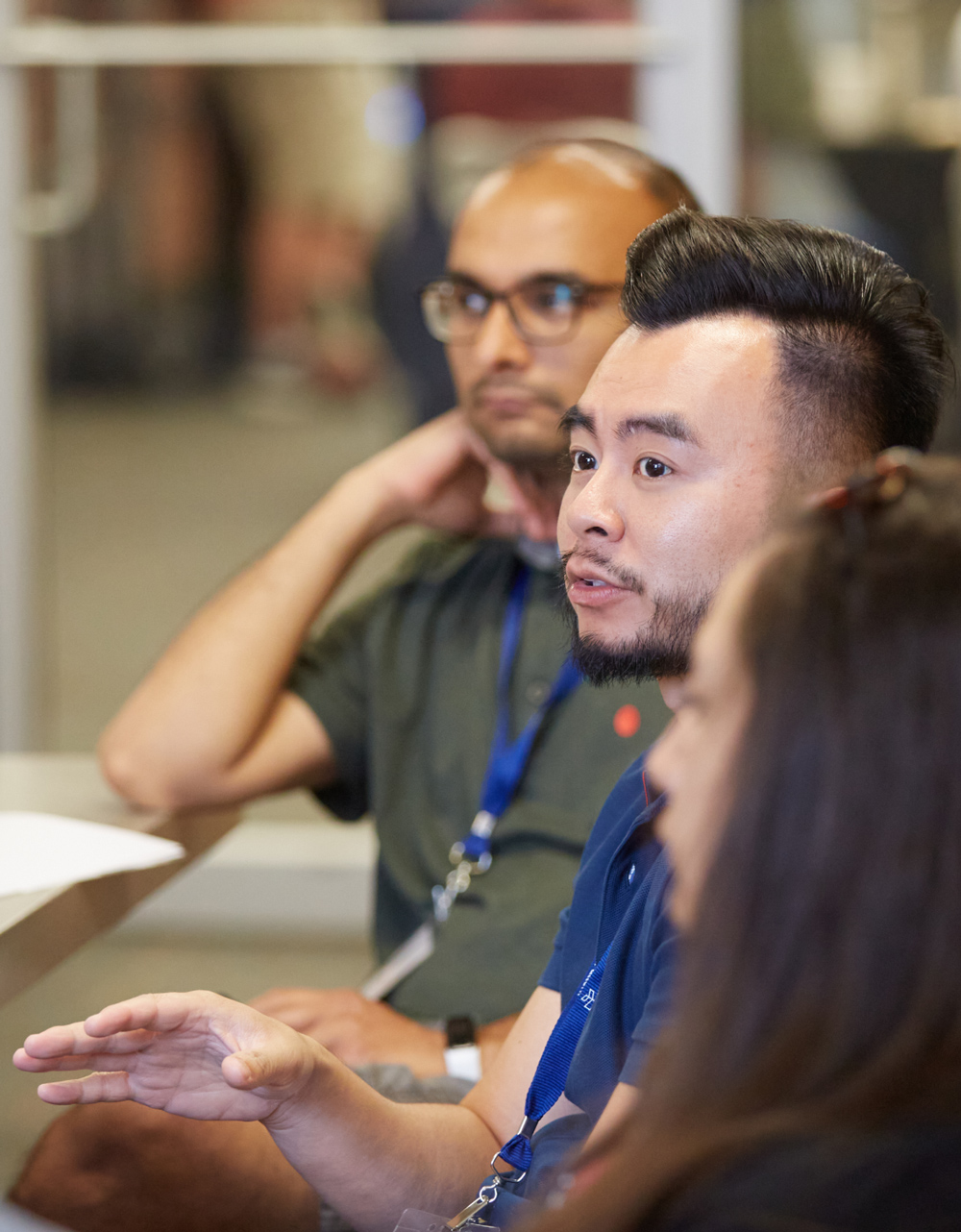 A man speaking in a group.