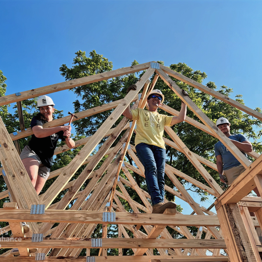 A group building a building.