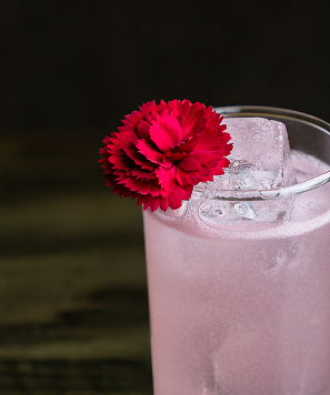 Kultura bar cocktail with red flower and ice