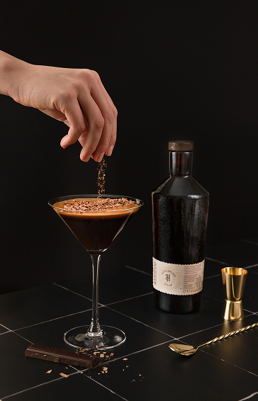 Espresso Martini with golden spun on the blac table
