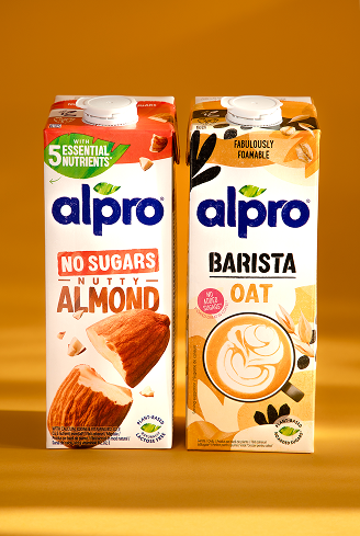 Alpro milk in carton with orange background