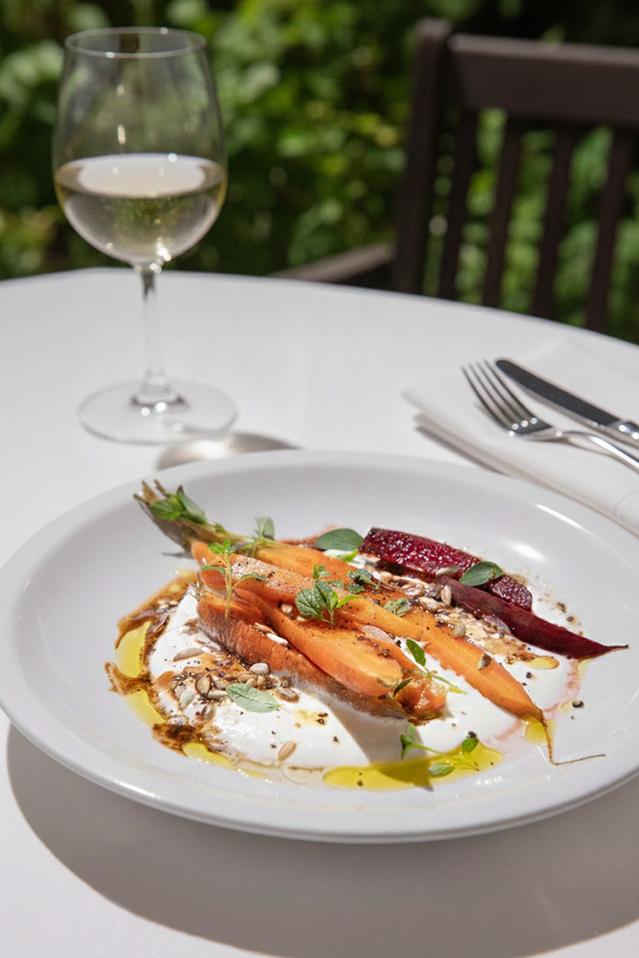 carrots with decoration on a white plate in a restaurant