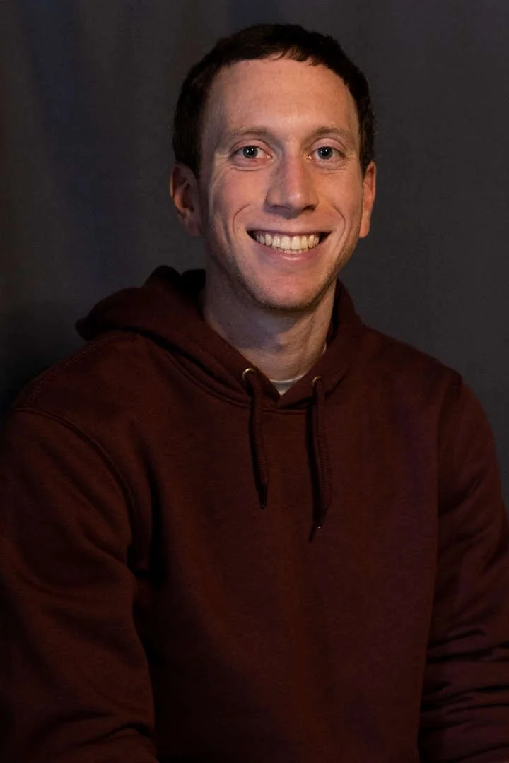 Mr Gretenstein smiling in a staff directory headshot photo