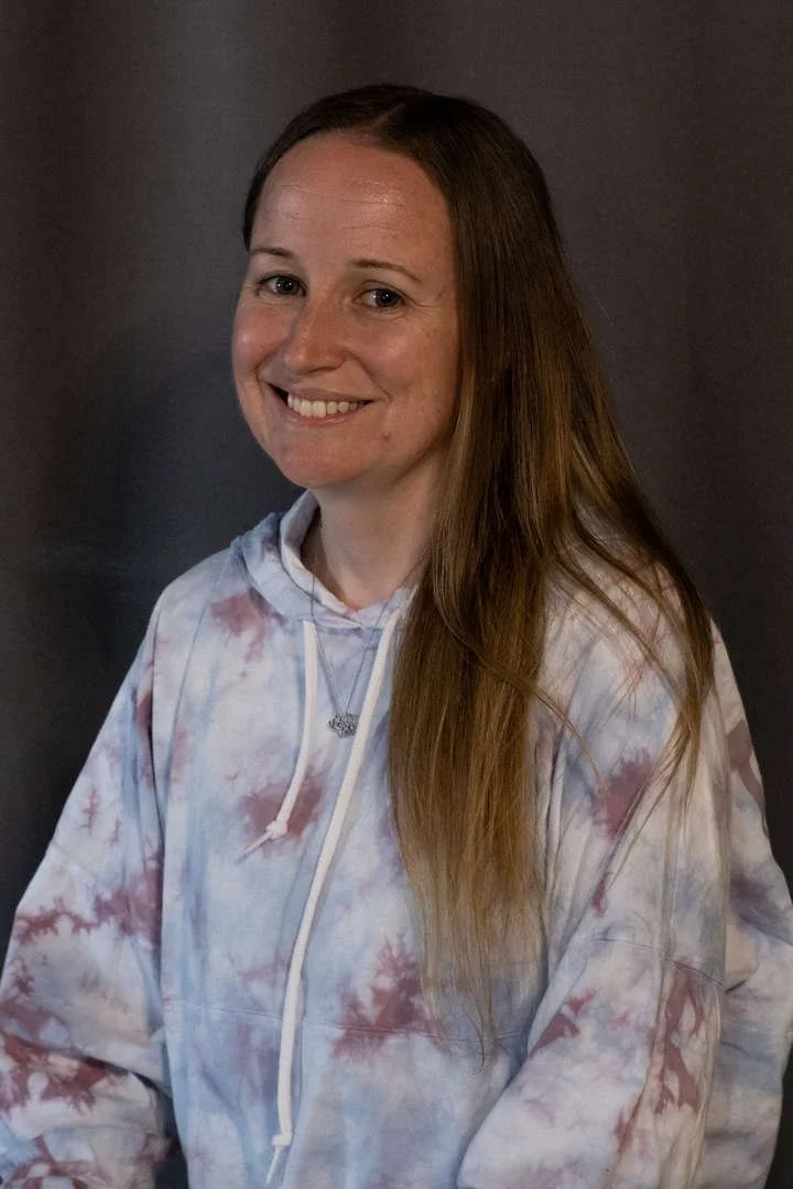 K Quinlan smiling staff portrait photo