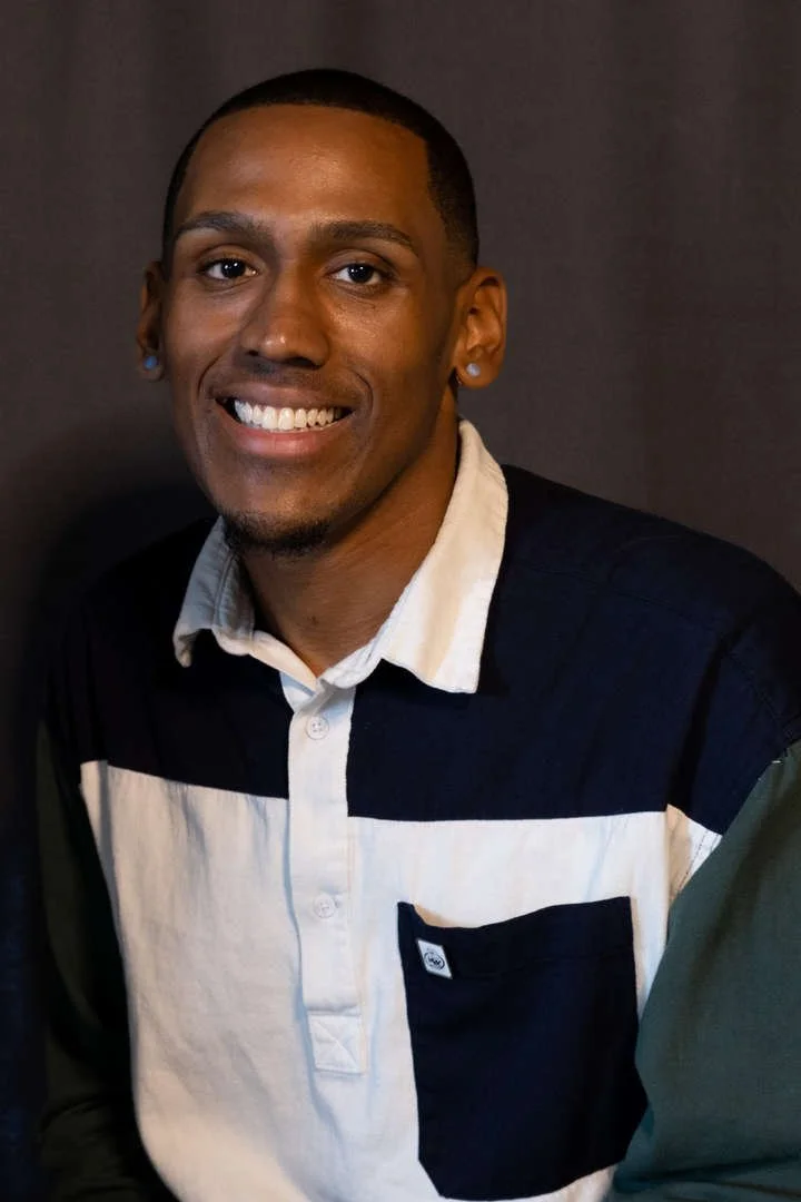 Staff member D. Water smiling in a professional portrait photo