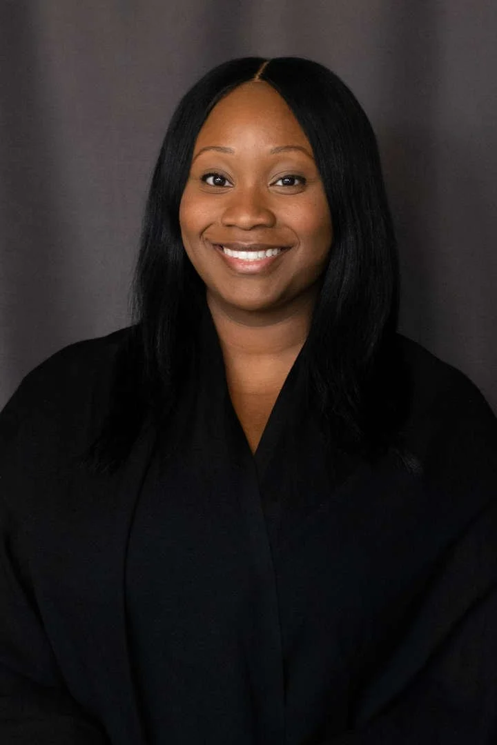 Staff member E Manners professional headshot portrait
