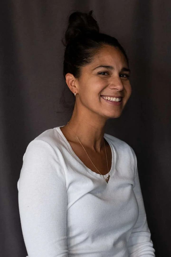 T Rivera smiling in a staff portrait photo
