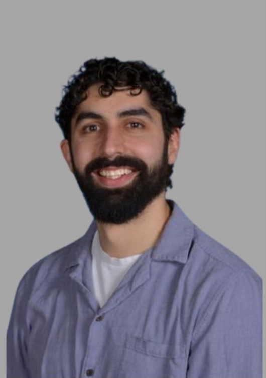 Staff member S Mercuris smiling in professional headshot
