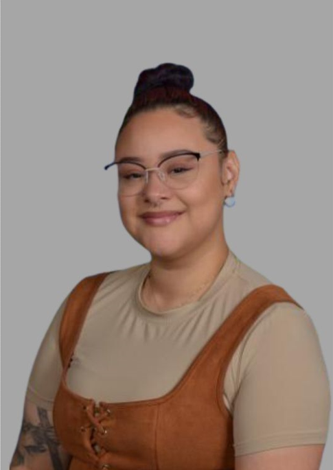 G Alvarado smiling in a professional staff portrait photo