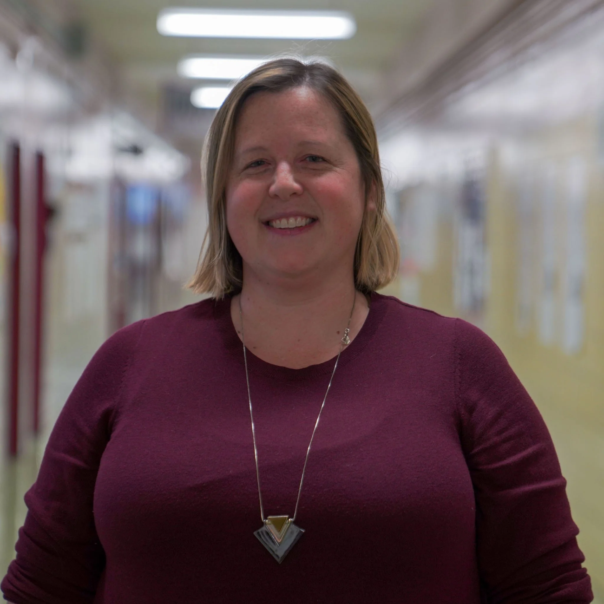 Kaia Nordtvedt smiling in a school hallway