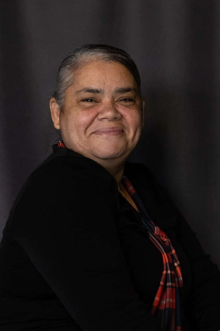 Staff member C Ventura smiling in professional portrait photo