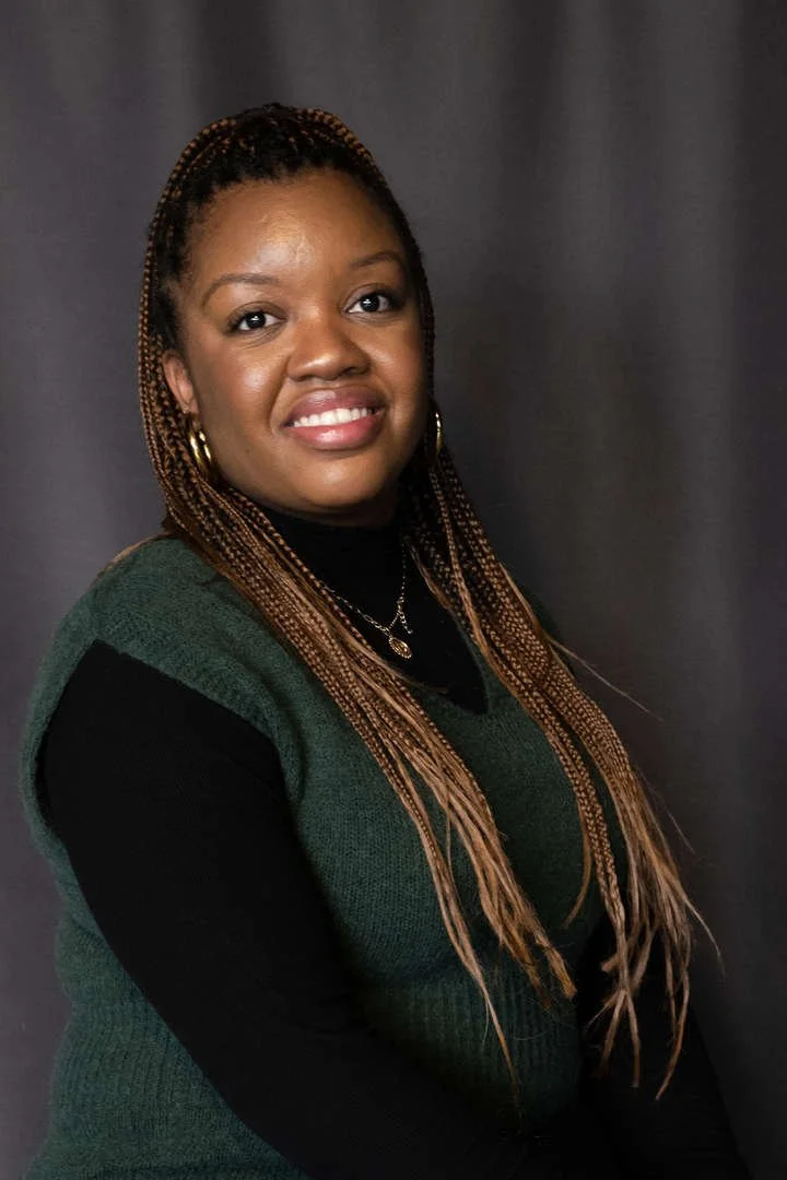 Staff member A. Hanson smiling in professional headshot photo