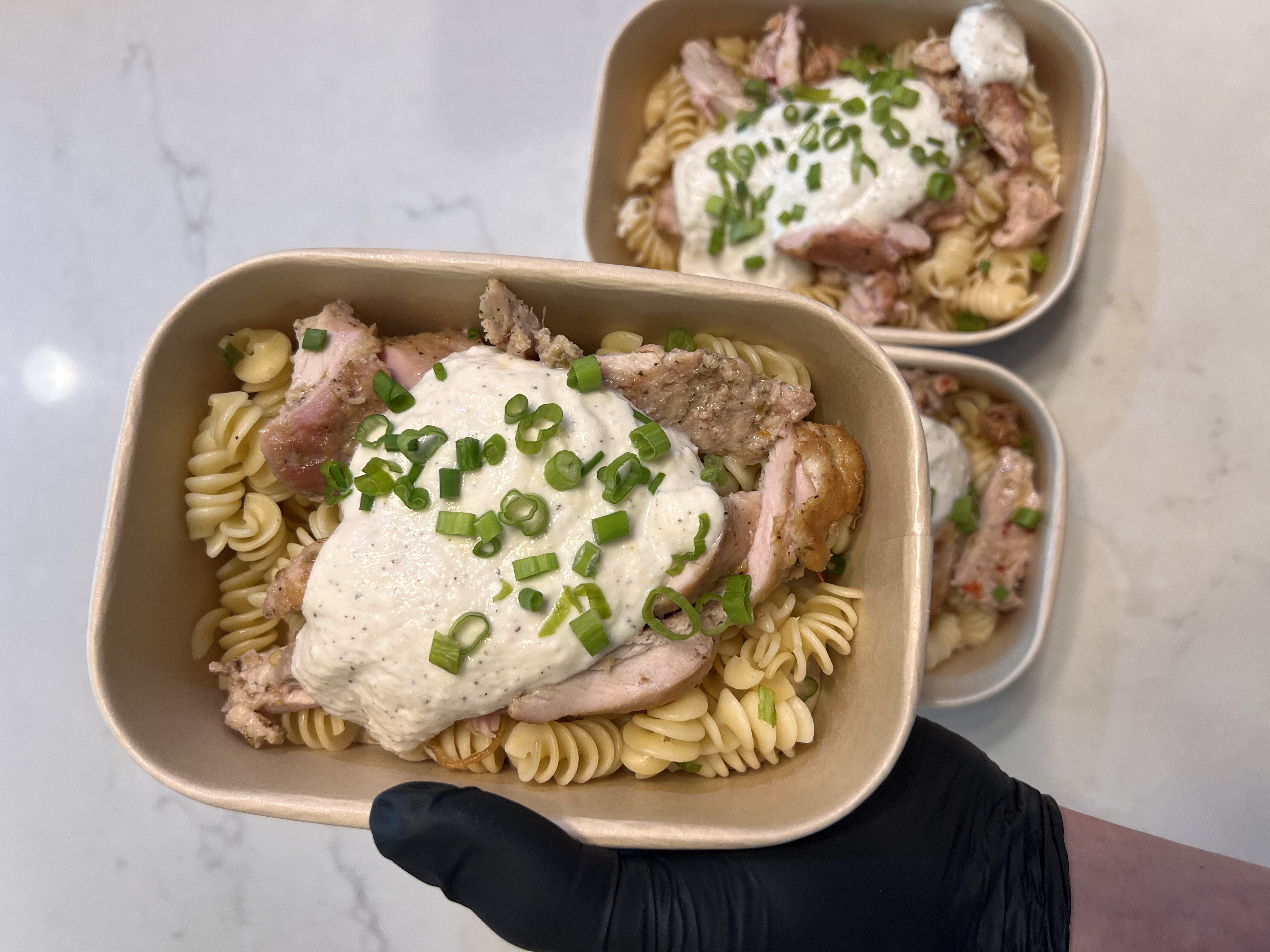 Chicken alfredo pasta with creamy sauce and parsley