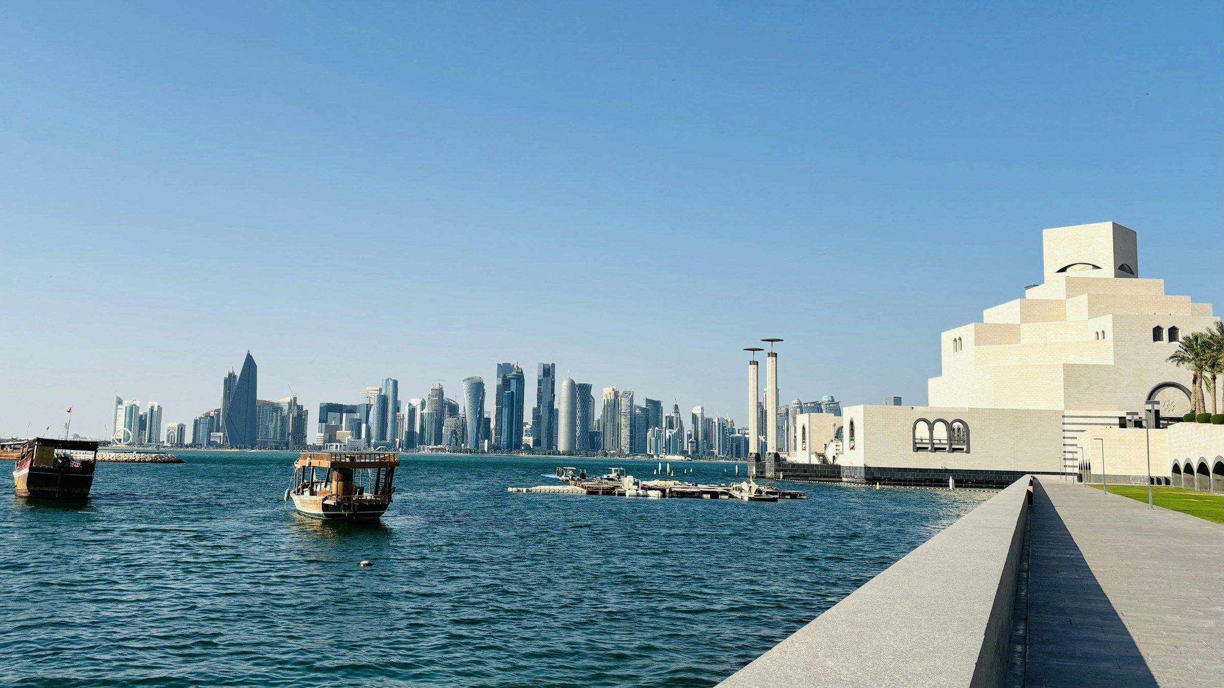 The West Bay skyline seen across the bay in daylight, Doha, Qatar