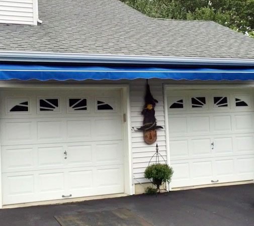 You can place retractable awnings on the side of the garage where the sun faces during the hottest part of the day