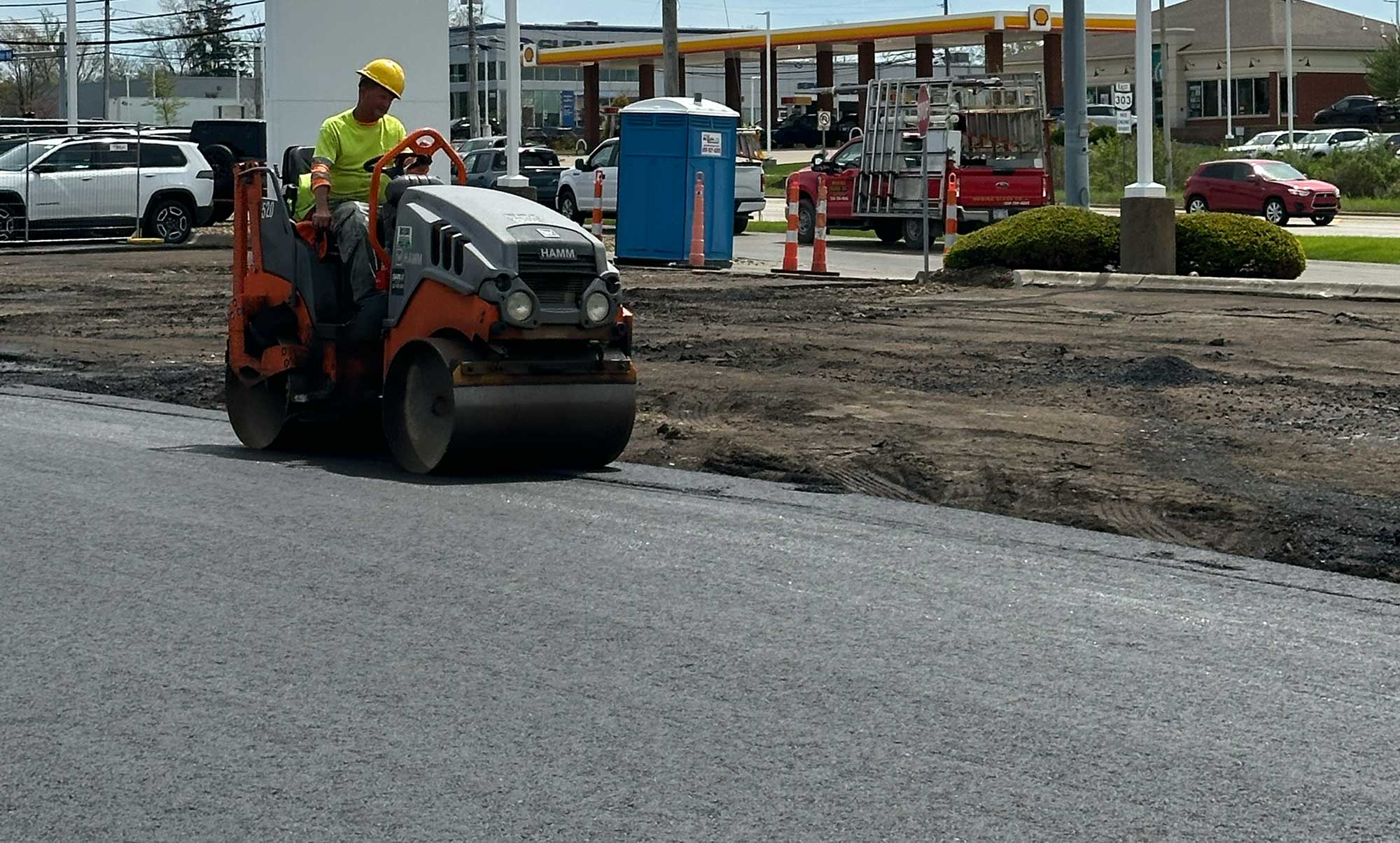 Freshly paved asphalt parking lot at Brunswick Toyota dealership with smooth finished surface