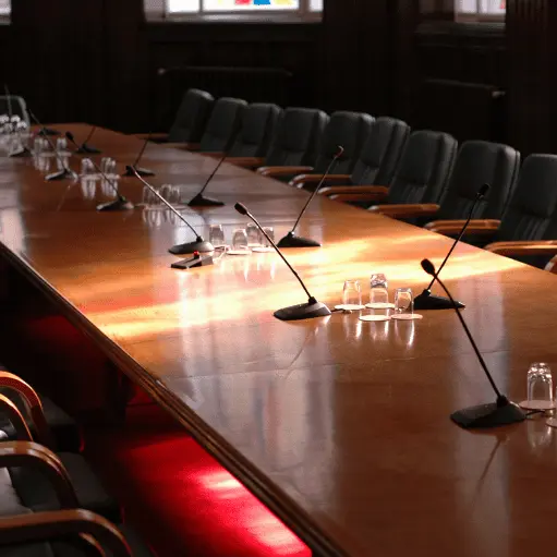 Executive boardroom with integrated AV technology designed for professional collaboration.