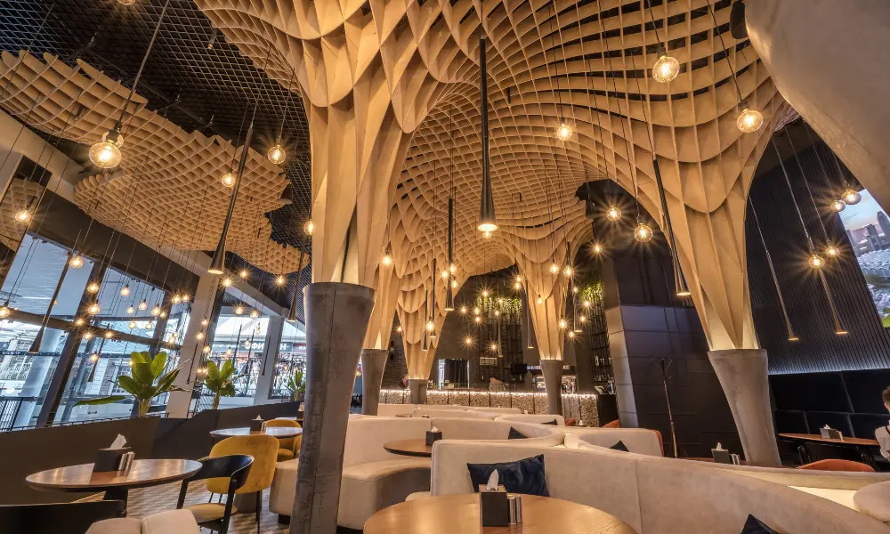 Sophisticated restaurant interior featuring architectural lighting that enhances the dining atmosphere.