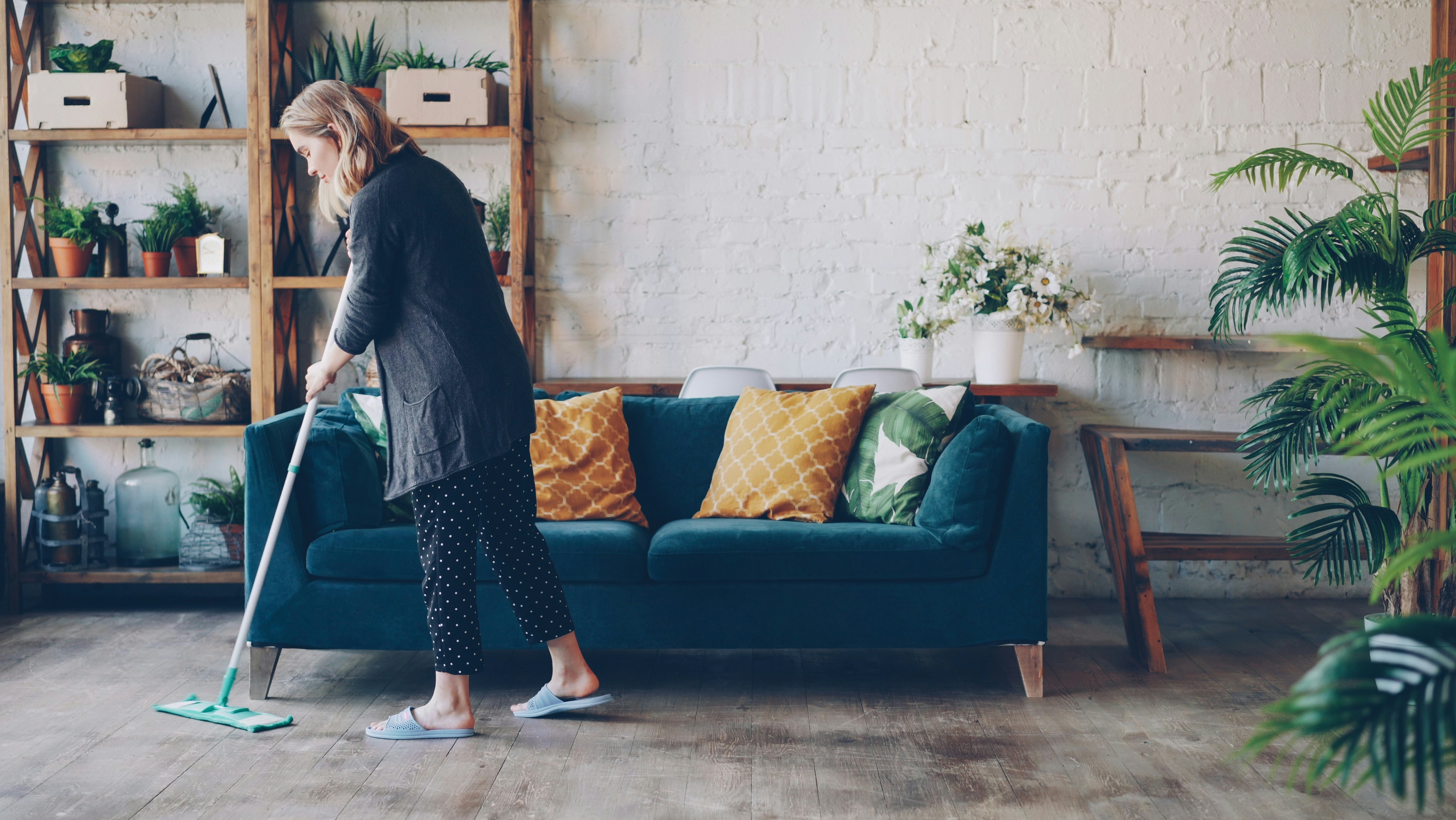 Professional house cleaner at work in a client's home