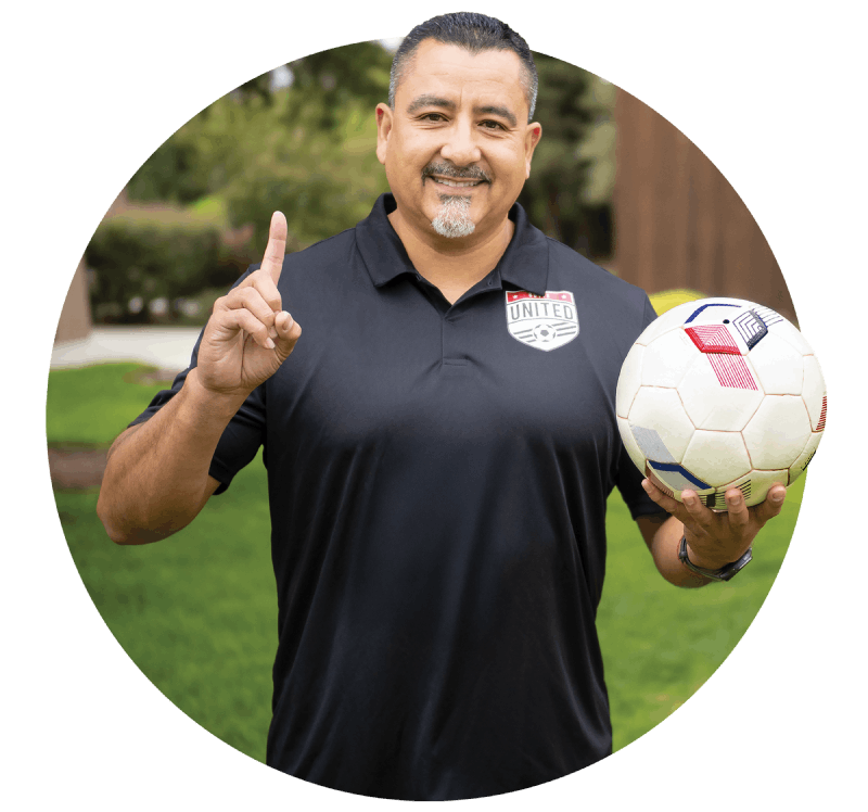 A man holding up his finger in the form of a 1