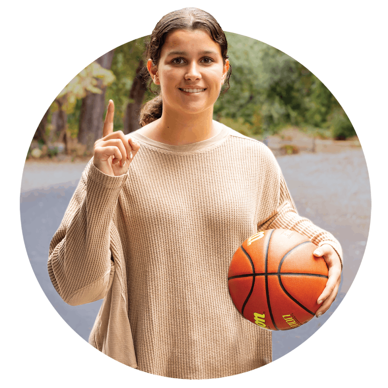 A young woman holding up her finger in the form of a 1