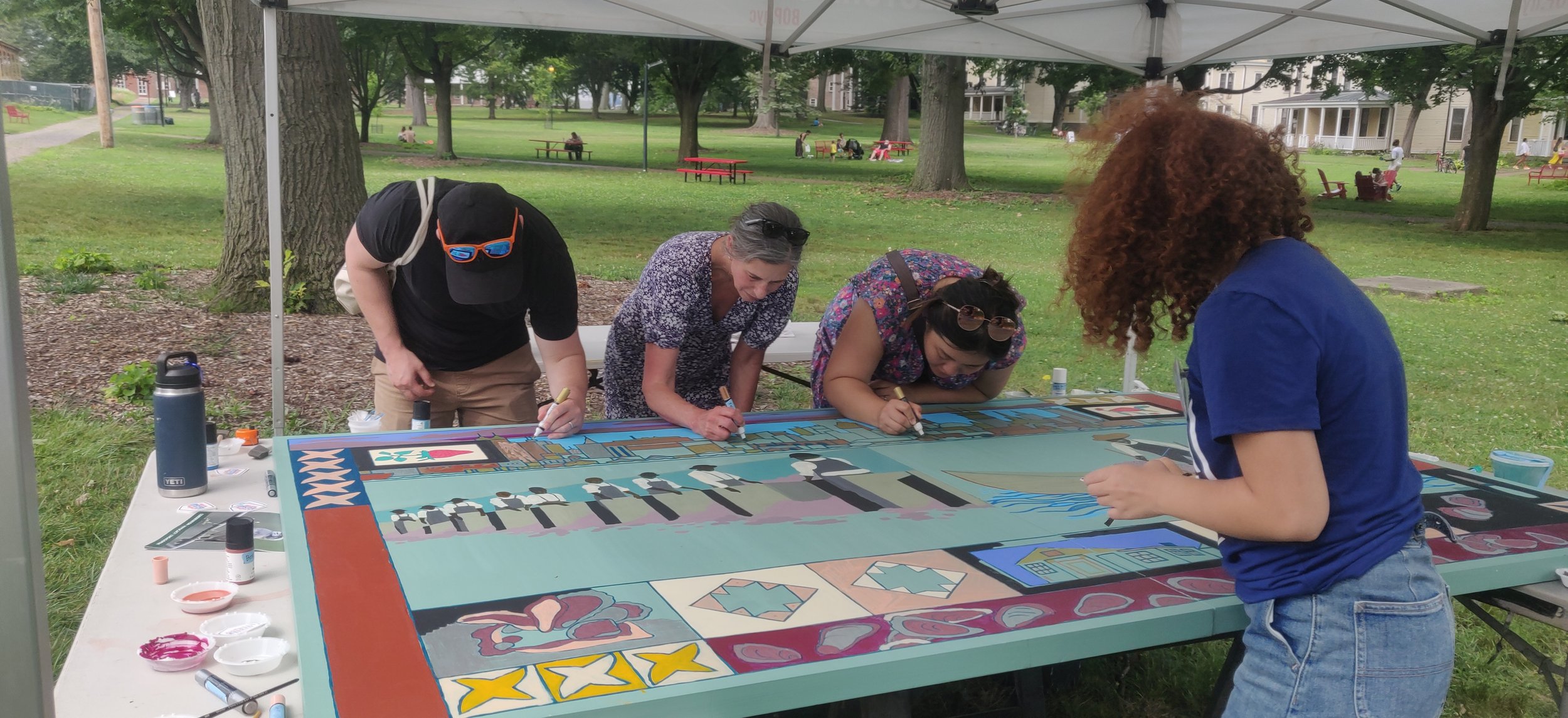 Participants painting the interactive mural