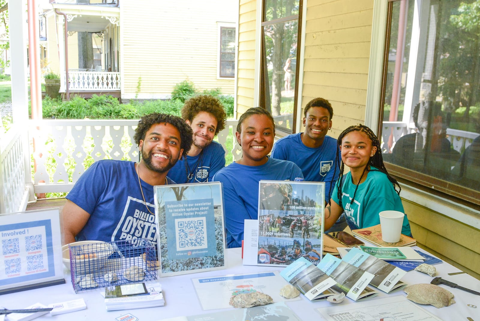 Volunteers staff a Billion Oyster Project information table