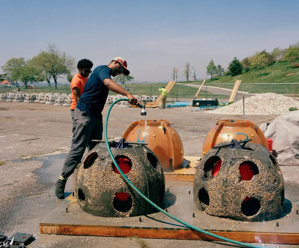 Johnny Anderson and Joshua Taliaferrow fabricating reef balls.