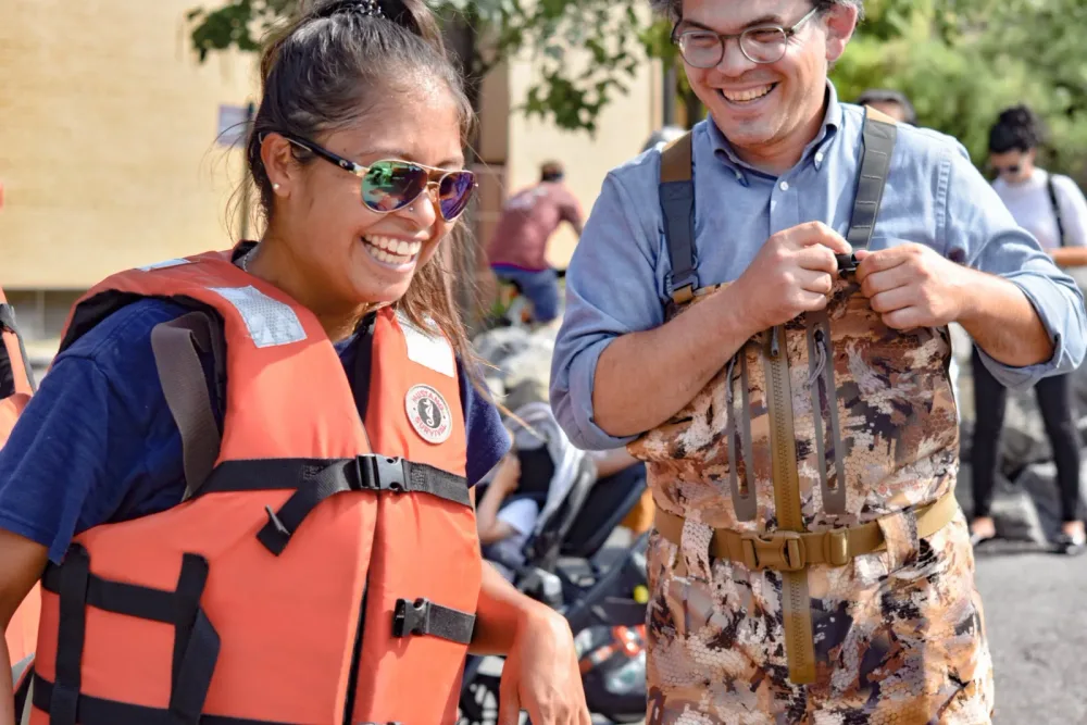 Two Billion Oyster Project team members in a life vest and waders
